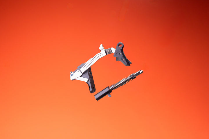 VEX 6 drop-in trigger kit with striker on red background landscape